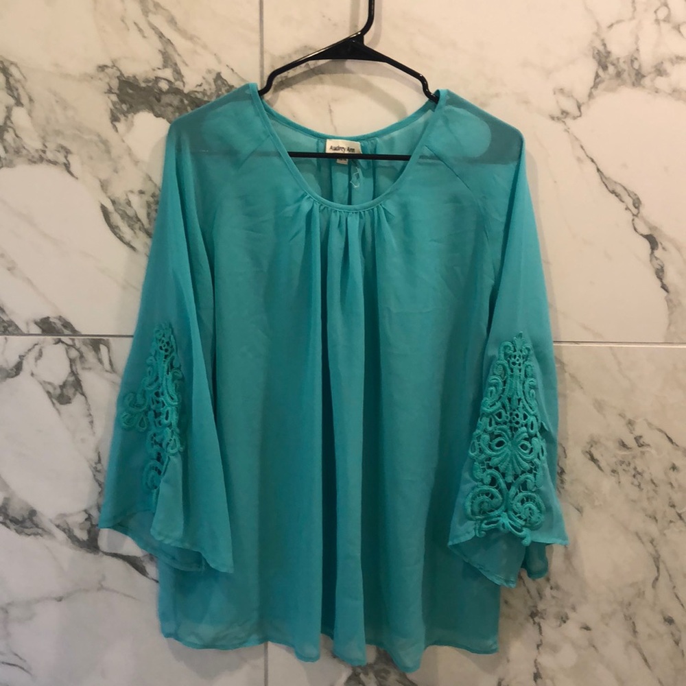 Gorgeous aqua blouse with lace detail on sleeves